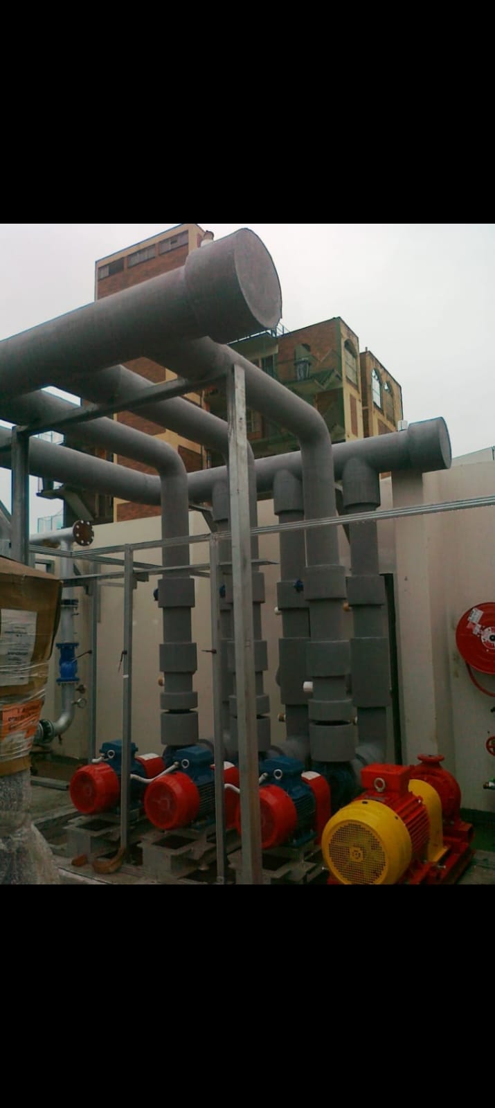 Grey chilled water piping on rooftop